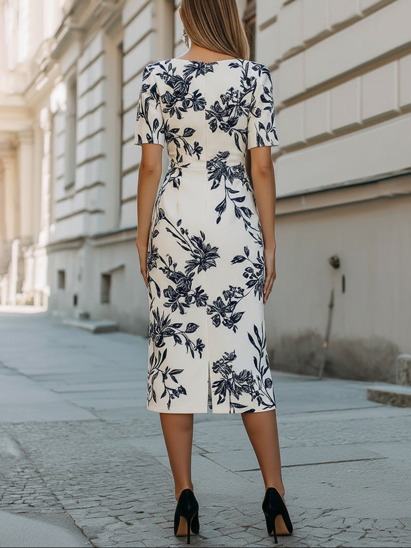 Elegancka sukienka midi z krótkim rękawem w botaniczny wzór